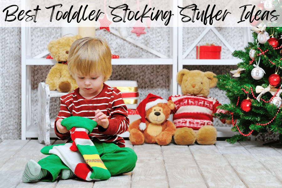 toddler looking into Christmas stocking