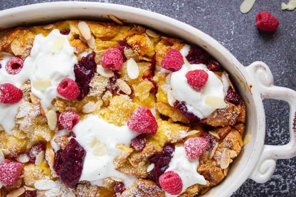 overnight brioche french toast casserole with raspberries and almonds